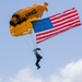 Army Golden Knights make parachute jump with American flag for the 108th Indy 500