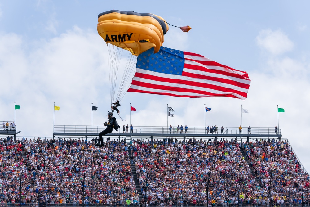 Army Golden Knights make parachute jump with American flag for the 108th Indy 500