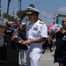 Rear Adm. Carlos Sardiello, commander, Carrier Strike Group (CSG) 1, addresses the public.