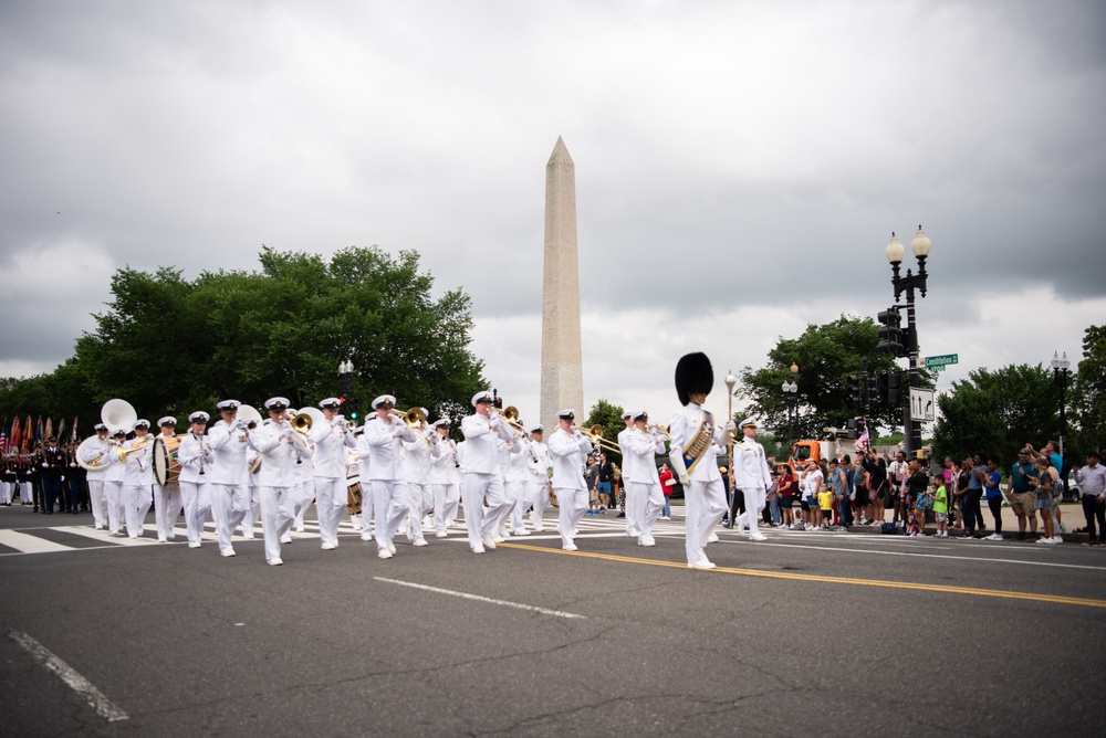 The United States Navy Band marches in the National Memorial Day Parade along Constitution Avenue in Washington, DC.