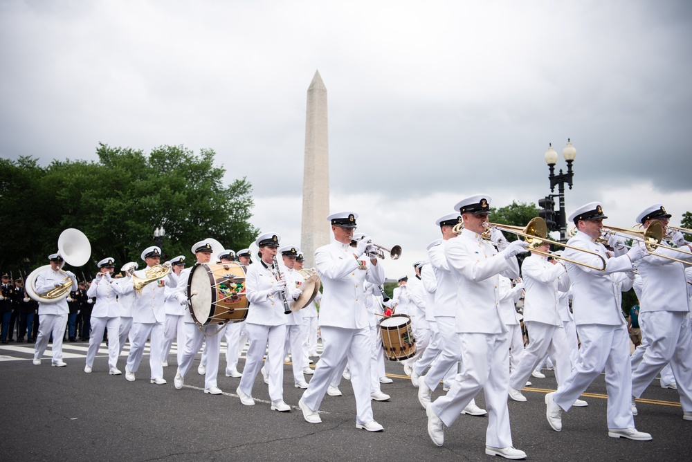 The United States Navy Band marches in the National Memorial Day Parade along Constitution Avenue in Washington, DC.