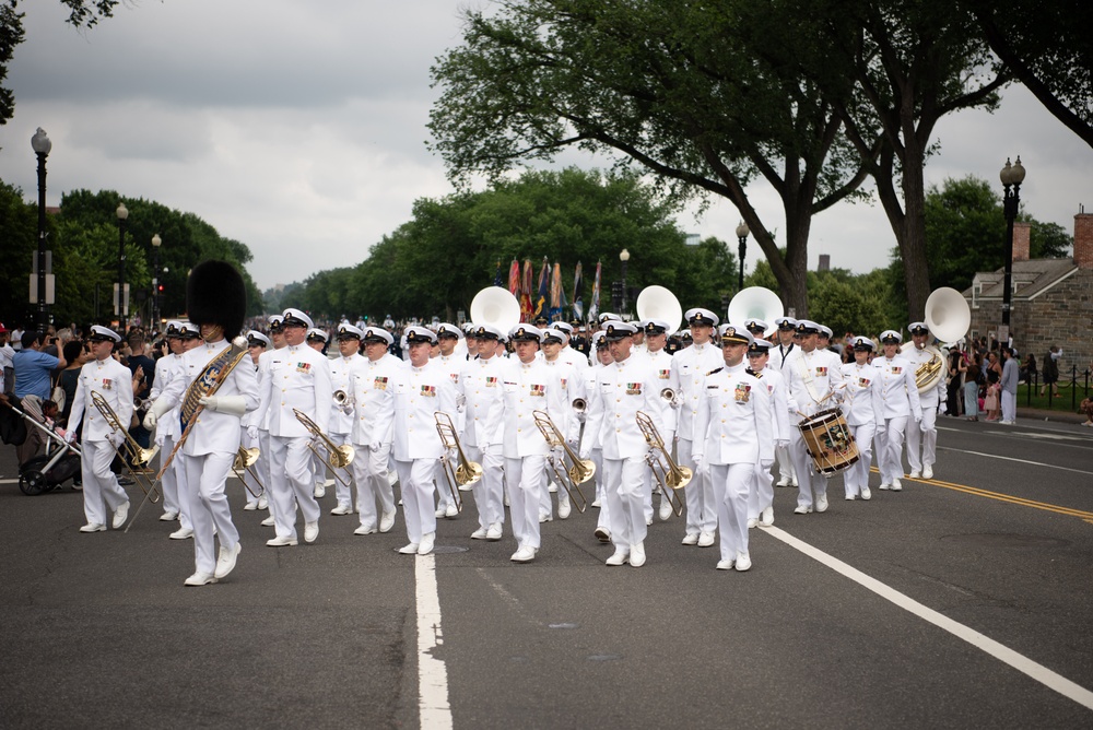 The United States Navy Band marches in the National Memorial Day Parade along Constitution Avenue in Washington, DC.