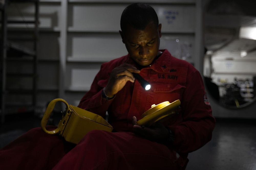 Sailor conducts maintenance aboard Abraham Lincoln
