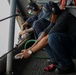 Sailors conduct maintenance on Abraham Lincoln