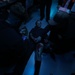 Sailors aboard the USS Howard conduct a medical emergency drill in the combat information center in the South China Sea