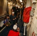 Sailors aboard the USS Howard conduct a medical emergency drill on the mess decks in the South China Sea