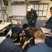 Sailors aboard the USS Howard conduct a medical emergency drill in the central control station in the South China Sea