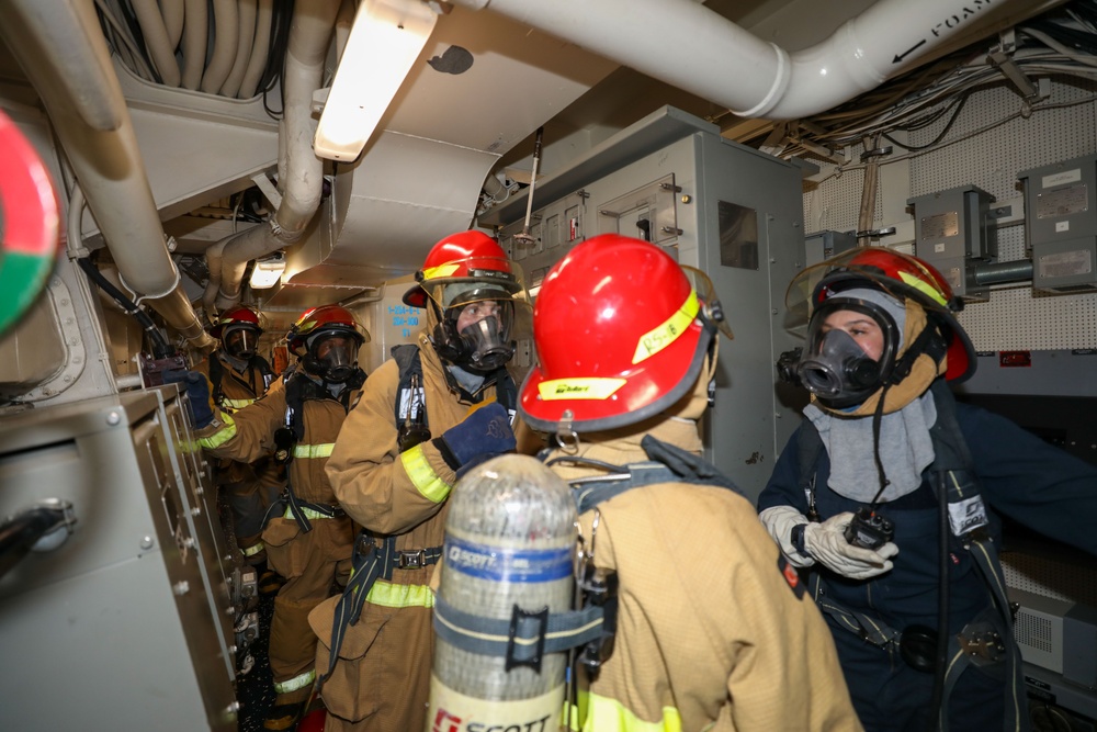 Sailors aboard the USS Howard conduct a general quarters drill in the South China Sea