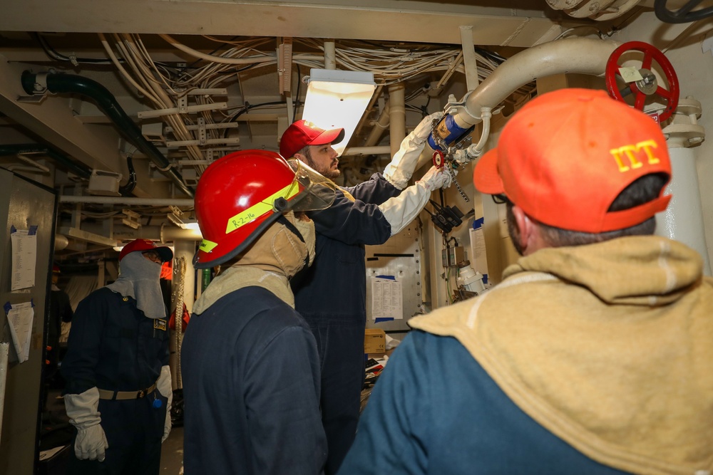 Sailors aboard the USS Howard conduct a general quarters drill in the South China Sea