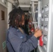 Sailors aboard the USS Howard conduct routine maintenance in the North Pacific Ocean