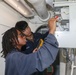 Sailors aboard the USS Howard conduct routine maintenance in the North Pacific Ocean