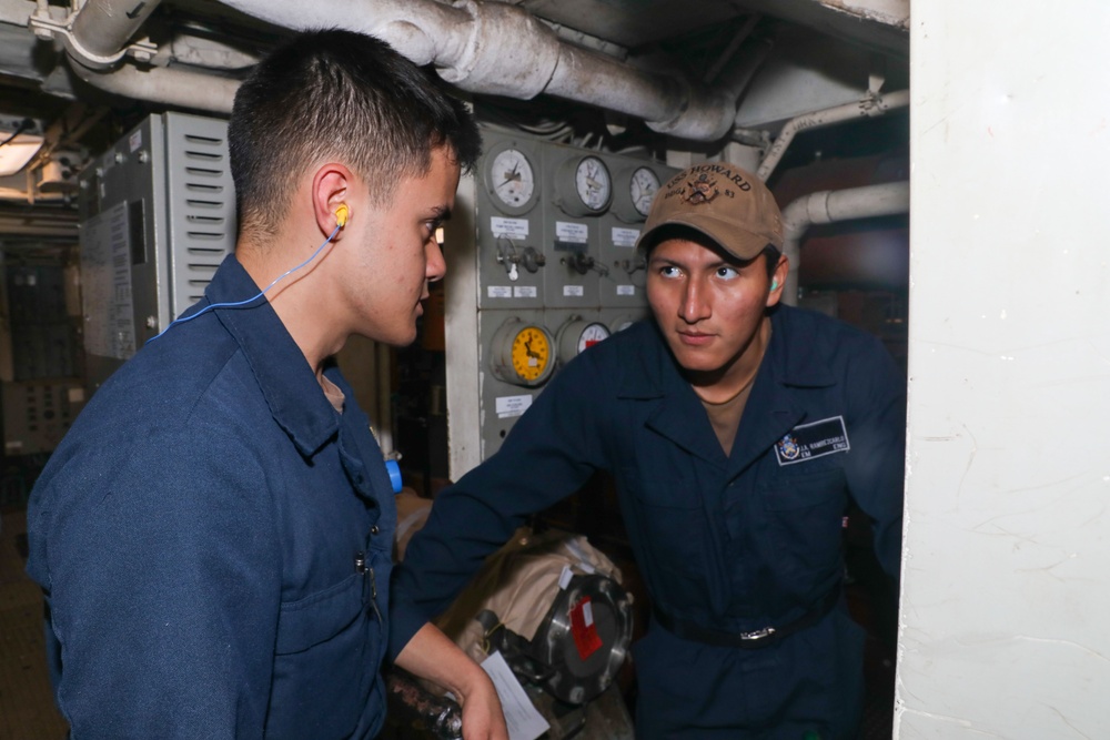 Sailors aboard the USS Howard conduct engineering training team drills in the North Pacific Ocean