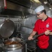 Sailors aboard the USS Howard prepare dinner in the North Pacific Ocean