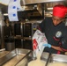 Sailors aboard the USS Howard prepare dinner in the North Pacific Ocean