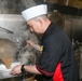 Sailors aboard the USS Howard prepare dinner in the North Pacific Ocean