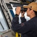 USS Ronald Reagan (CVN 76) Sailors stand watch in the pilot house