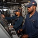 USS Ronald Reagan (CVN 76) Sailors stand watch in the pilot house