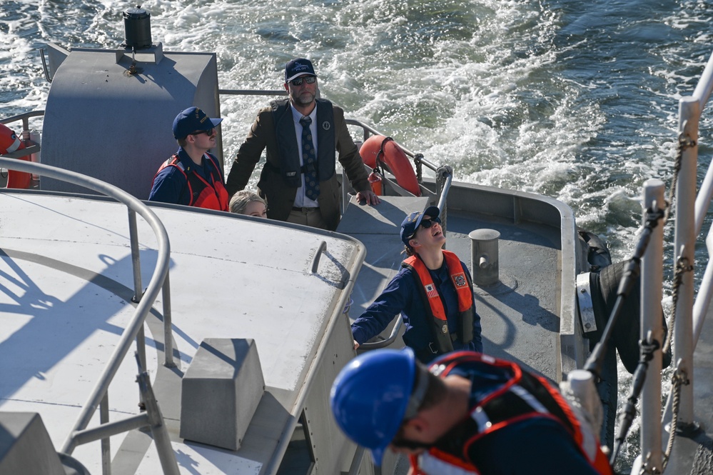 U.S. Coast Guard small boat transferring passengers onto USCGC Calhoun