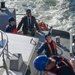 U.S. Coast Guard small boat transferring passengers onto USCGC Calhoun