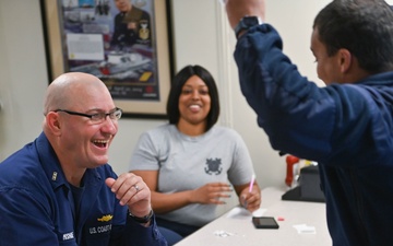 USCGC Calhoun crew members celebrate during trivia night