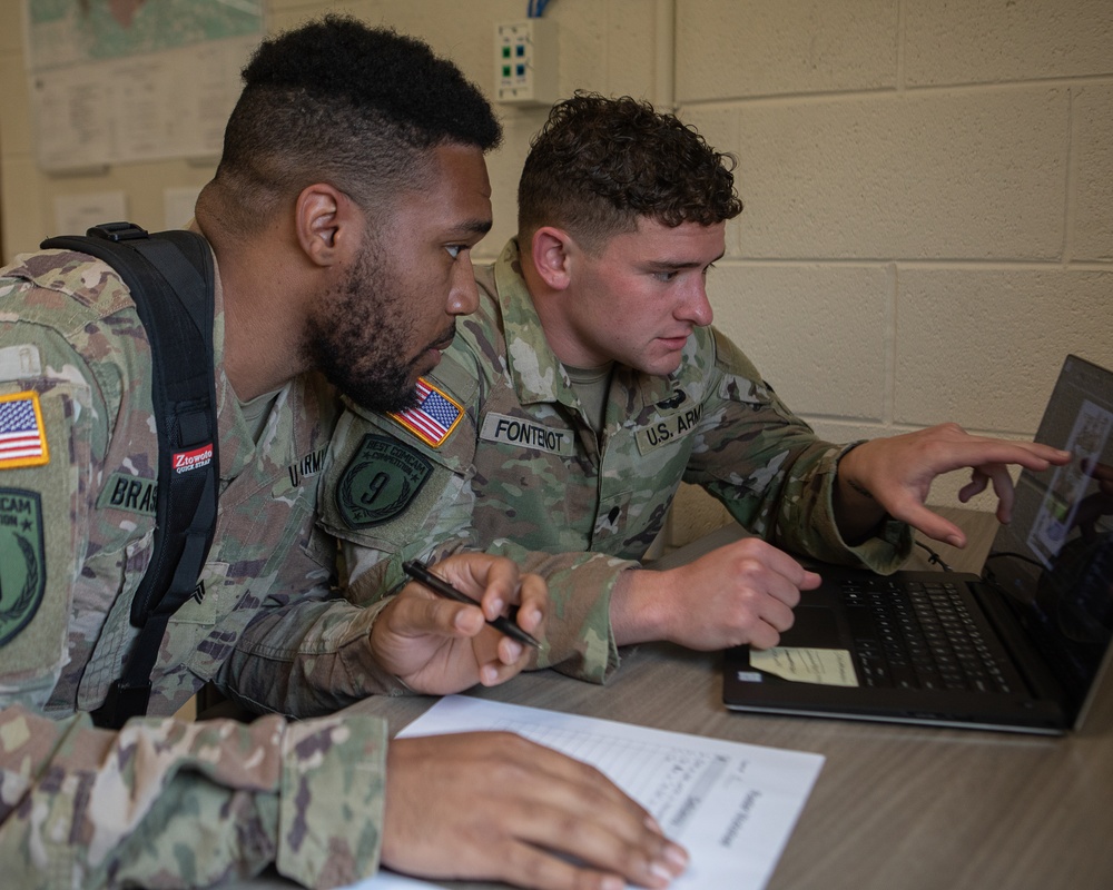 Participants of the 11th Annual Best Combat Camera Competition prepare to compete in an event.