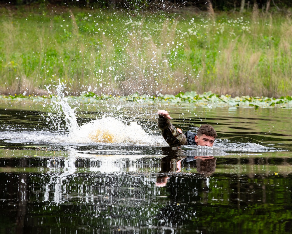 Participants of the 11th Annual Best Combat Camera Competition prepare to compete in an event.