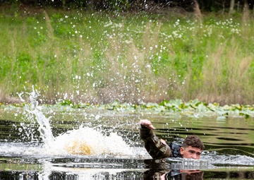 Participants of the 11th Annual Best Combat Camera Competition prepare to compete in an event.