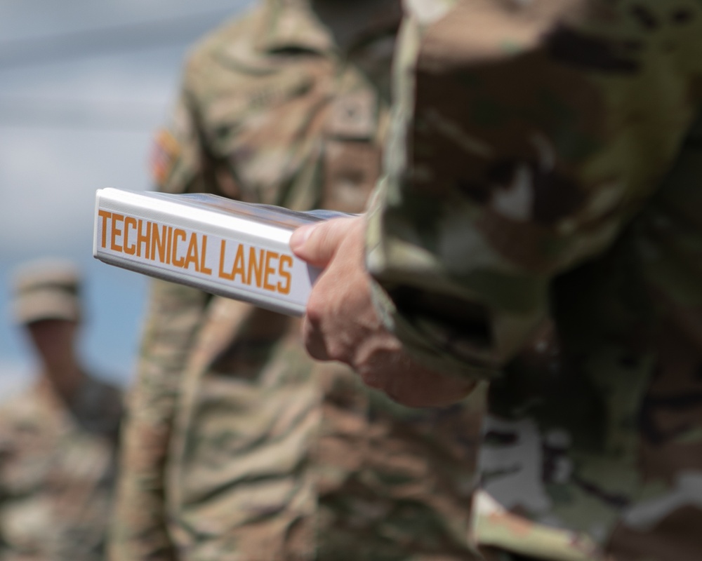 Participants of the 11th Annual Best Combat Camera Competition prepare to compete in an event.