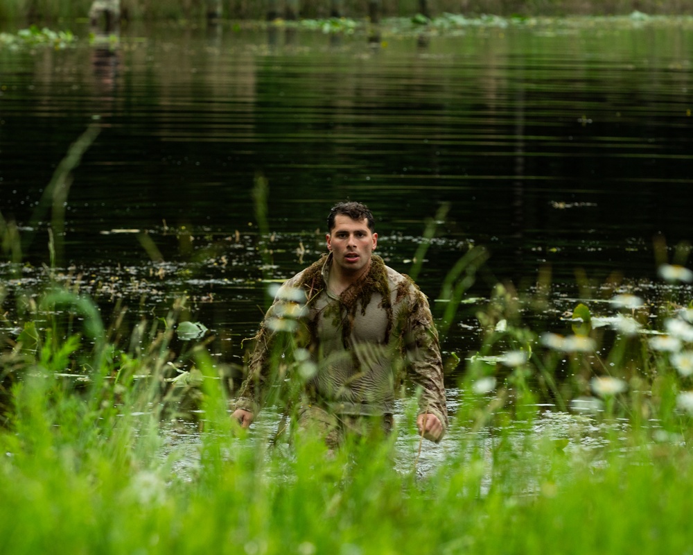 Participants of the 11th Annual Best Combat Camera Competition prepare to compete in an event.