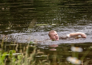 Participants of the 11th Annual Best Combat Camera Competition prepare to compete in an event.