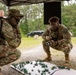 Participants of the 11th Annual Best Combat Camera Competition prepare to compete in an event.