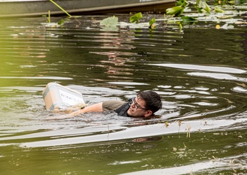 Participants of the 11th Annual Best Combat Camera Competition prepare to compete in an event.