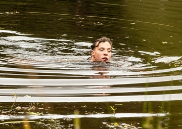 Participants of the 11th Annual Best Combat Camera Competition prepare to compete in an event.