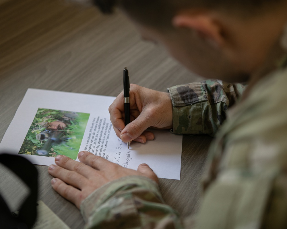 Participants of the 11th Annual Best Combat Camera Competition prepare to compete in an event.