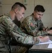 Participants of the 11th Annual Best Combat Camera Competition prepare to compete in an event.