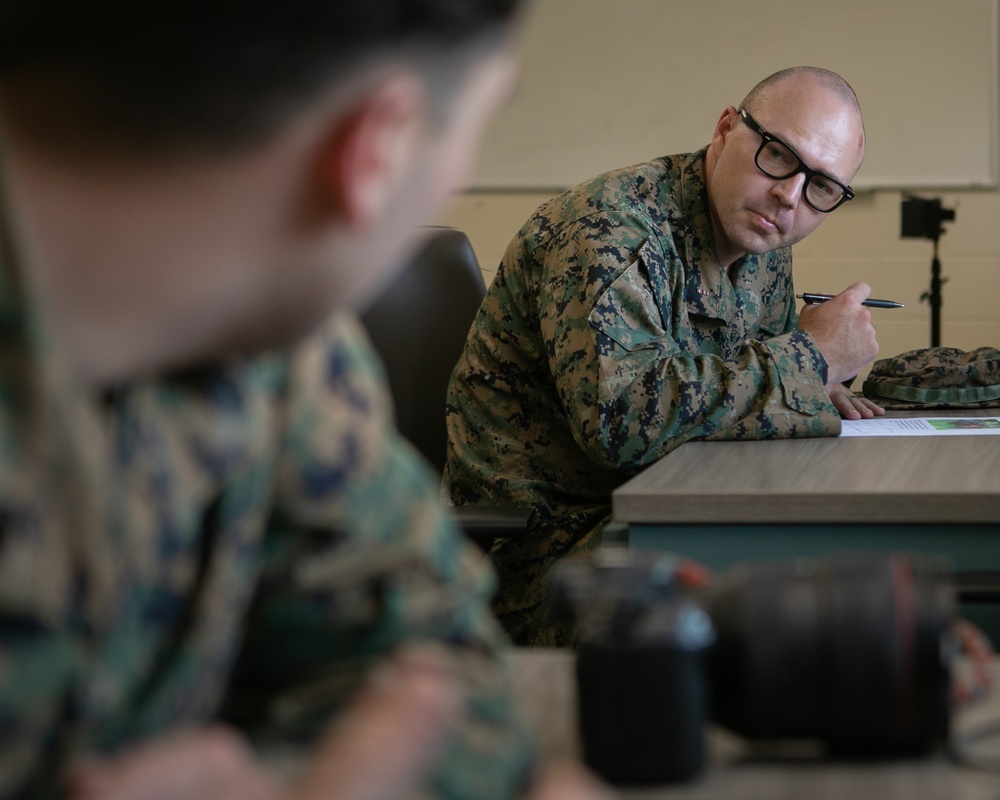 Participants of the 11th Annual Best Combat Camera Competition prepare to compete in an event.