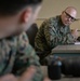 Participants of the 11th Annual Best Combat Camera Competition prepare to compete in an event.