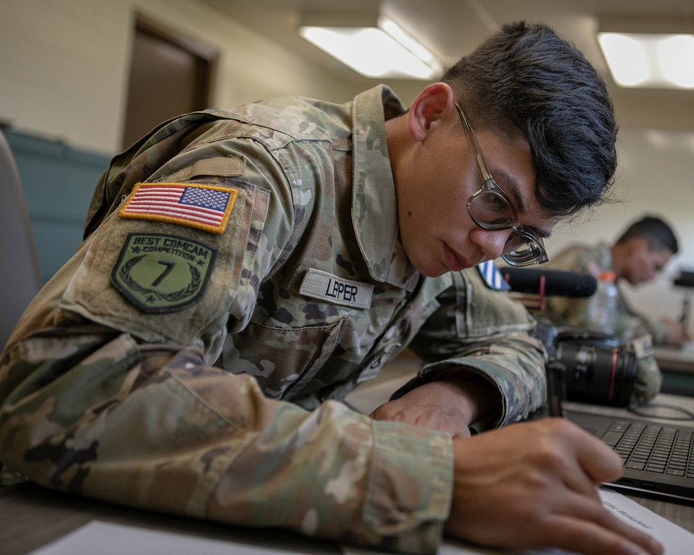 Participants of the 11th Annual Best Combat Camera Competition prepare to compete in an event.