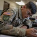 Participants of the 11th Annual Best Combat Camera Competition prepare to compete in an event.