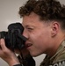 Participants of the 11th Annual Best Combat Camera Competition prepare to compete in an event.