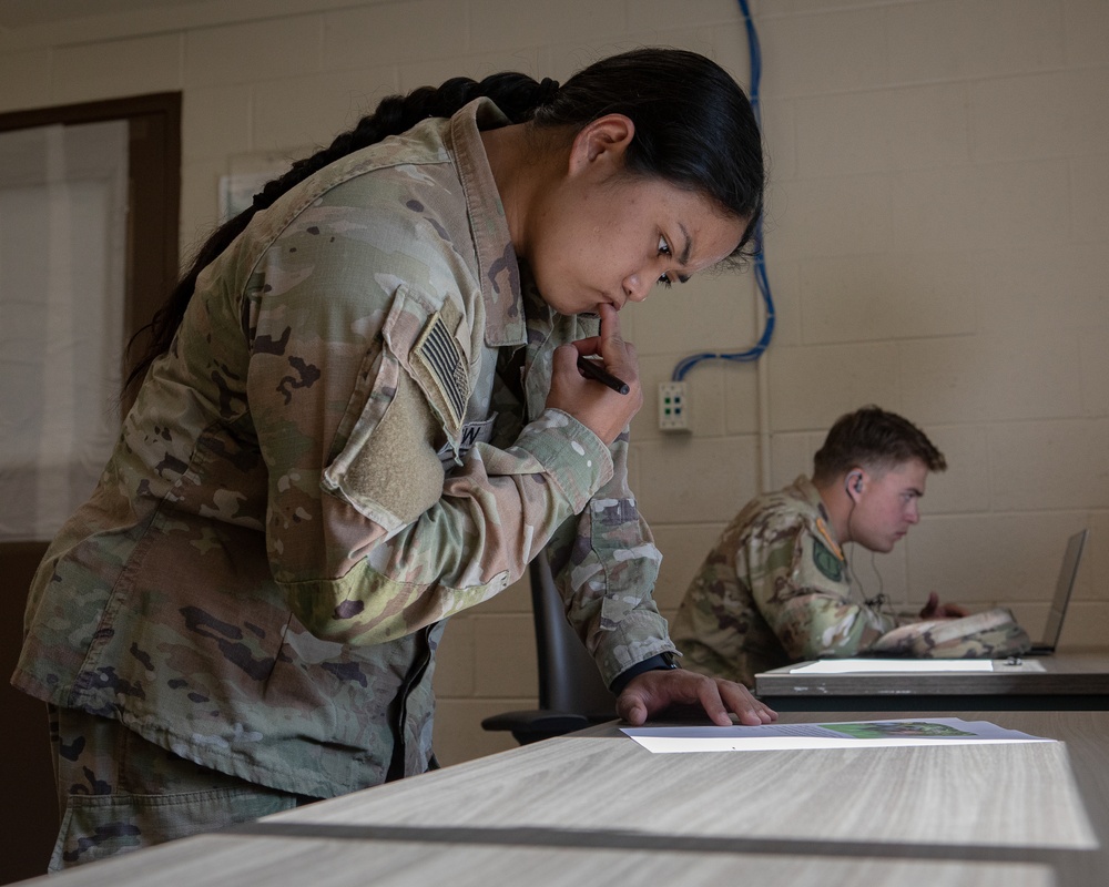 Participants of the 11th Annual Best Combat Camera Competition prepare to compete in an event.