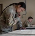 Participants of the 11th Annual Best Combat Camera Competition prepare to compete in an event.