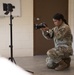 Participants of the 11th Annual Best Combat Camera Competition prepare to compete in an event.