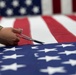 AFMAO prepares U.S. Flags