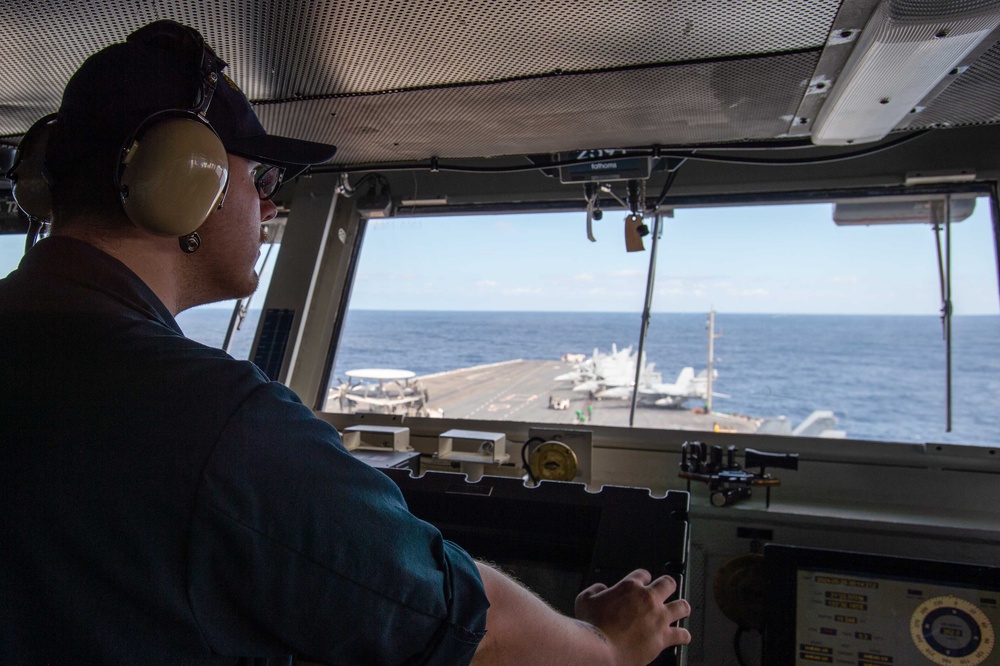 USS Ronald Reagan (CVN 76) Sailors stand watch in the pilot house