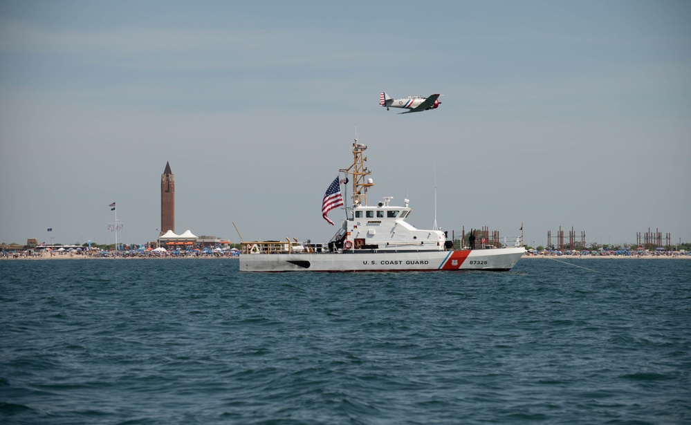 Warbird flies over USCGC Beluga during 2024 Bethpage Airhsow