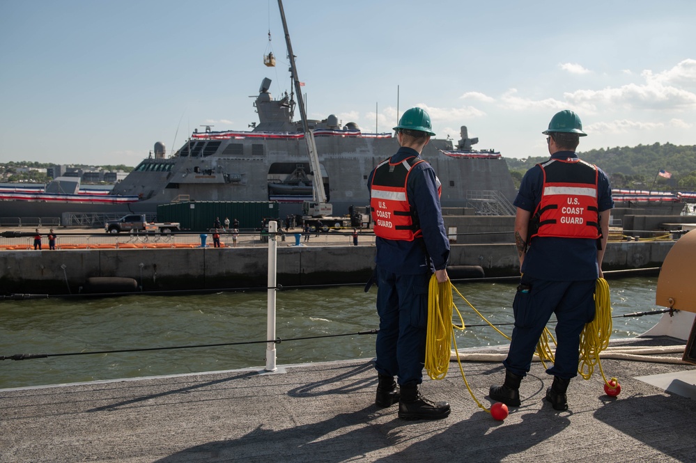 U.S. Coast Guardsmen prepare to moor USCGC Calhoun