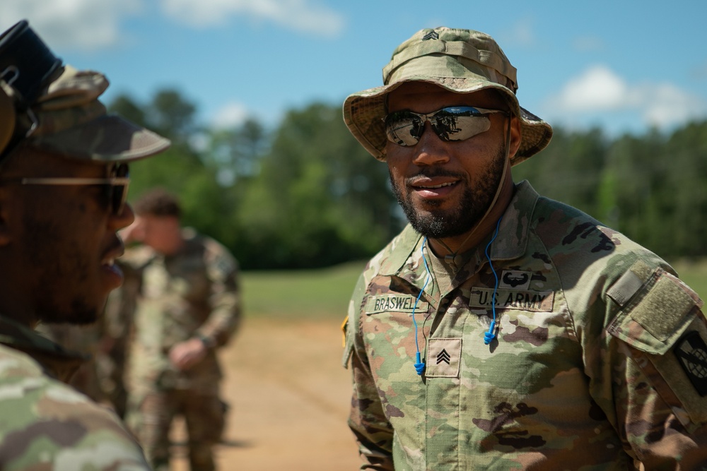 Participants of the 11th Annual Best Combat Camera Competition prepare to compete in an event.