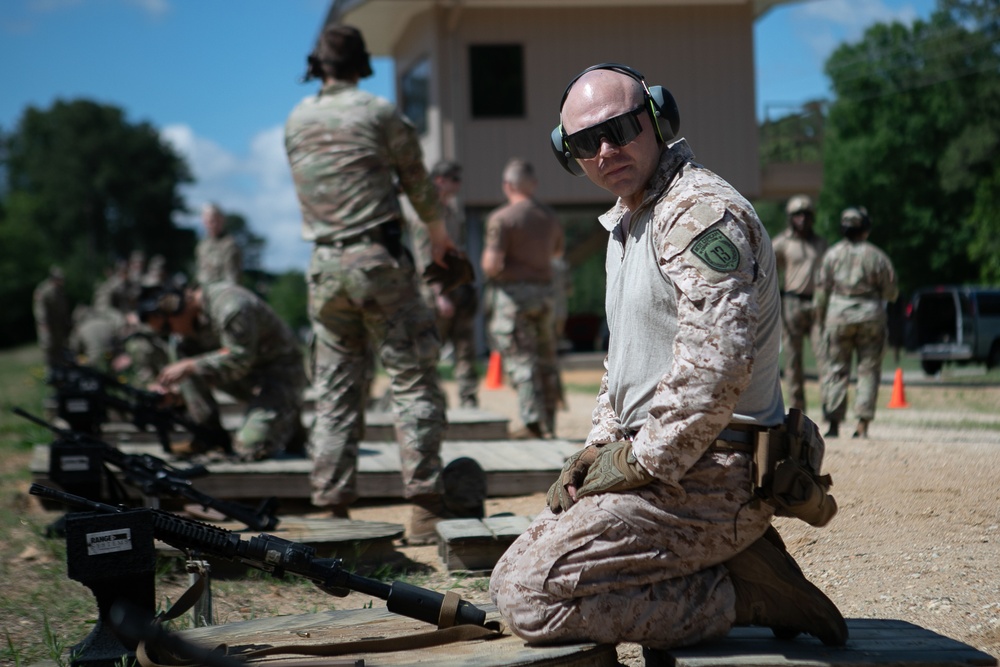 Participants of the 11th Annual Best Combat Camera Competition prepare to compete in an event.