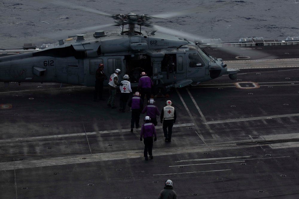 Sailors participate in a medical emergency drill aboard Abraham Lincoln